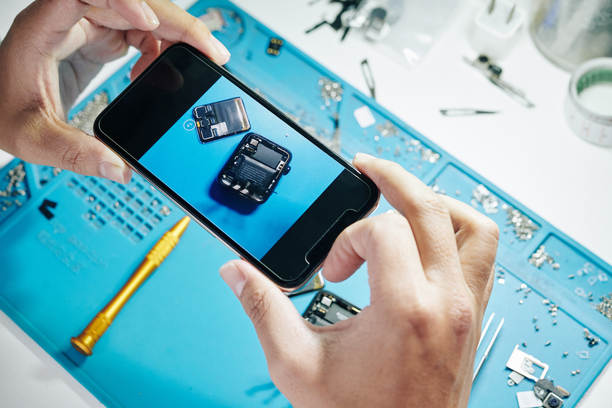 Man photographing fixed smartwatch
